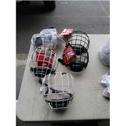 2 WHITE AND 2 BLACK ADULT LARGE CCM FM580 CAGES, 1 JUNIOR - RETAIL $250