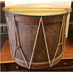 ANTIQUE DRUM WITH GLASS TOP CREATING A SIDE TABLE