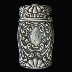 Sterling silver matchsafe with repousse desi