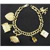 Image 1 : 14k gold charm bracelet with charms includin