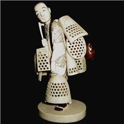 Oriental hand carved ivory figurine of peddl