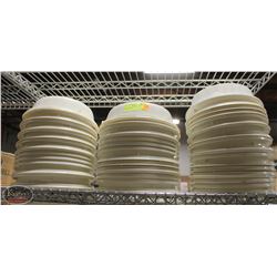 TWO STACKS OF WHITE PLASTIC PLATE COVERS