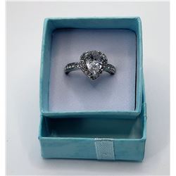 13)  SILVER TONE AND CLEAR CZ PEAR SHAPED