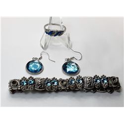 7) SUITE OF AQUA BLUE CRYSTALS AND SILVER