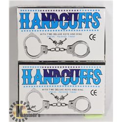 TWO HANDCUFFS WITH KEYS