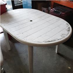 White plastic patio table