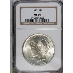 1923 S$1 MS66 NGC. Pale gold and blue accents appear i 