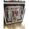 Image 1 : ANDREJ MEZAROS GAME-USED WORLD JUNIOR HOCKEY JERSEY (FRAMED 42" x 46")