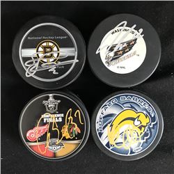 4 SIGNED NHL HOCKEY PUCKS