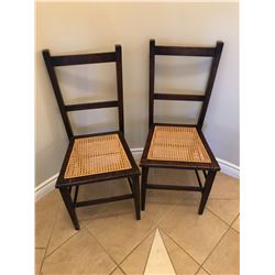 2 wood and wicker chairs