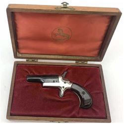 Colt Derringer single shot pistol, .22 Short caliber, Serial #55724D. The pistol is as new in the