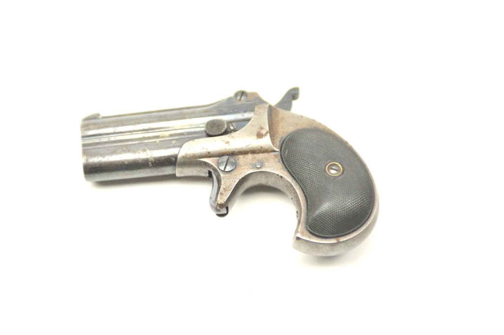 Remington Over/Under derringer, .38 caliber, Serial #522. The pistol is ...
