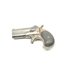 Remington Over/Under derringer, .38 caliber, Serial #522. The pistol is in nearly fine overall co