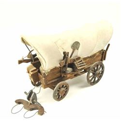 Completely Handmade and hand carved Conestoga  wagon by artist and not mass produced.  Estimated 50-