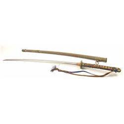 Japanese WWII Era “Samurai” sword in military mounts. The handle is missing ray skin and unravelin
