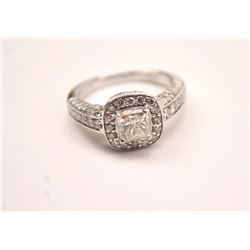 One 18 k white gold ring set with a 1.02ct  radiant cut diamond surrounded by 58 diamonds  weighing 