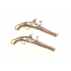 Pair of snaphance flintlock pistols by Giovanni Zambonetti circa 18th century with gilded brass en