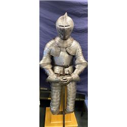 Authentic three-quarter suit of armor with closed helmet showing Alsatian crest with minor restora