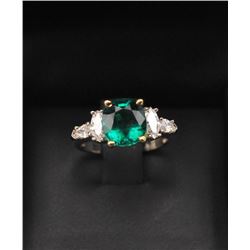 One magnificent custom designed ring set with a 2.65ct Colombian emerald set in 18k yellow gold he