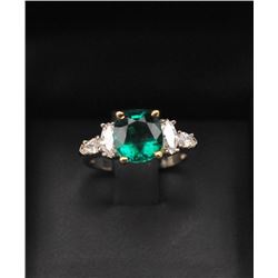 One magnificent custom designed ring set with  a 2.65ct Colombian emerald set in 18k yellow  gold he