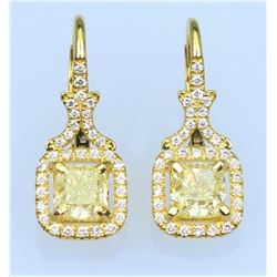 Elegant Fancy Yellow and White Diamond Earrings featuring two matching Radiant Cut Diamonds weighi