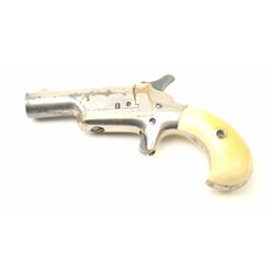 Colt 3rd Model Derringer in .41 rimfire caliber showing factory nickel finish and ivory grips, S/N