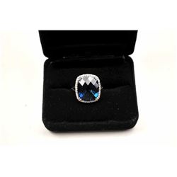 Beautiful London Blue Topaz ring with diamonds. The ring is nicely done in 14K white gold with an