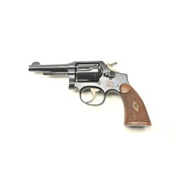 Smith & Wesson Hand Ejector Double Action revolver in .32-20 caliber with a 4” barrel, blued finis