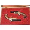 Image 2 : Cased pair of Colt Derringers, #73590D and  73591D, .22 short cal., 2 3/8” barrels, black  with gold