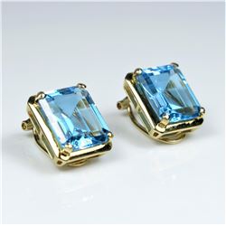 Stunning Swiss Blue Topaz and Diamond Earrings featuring 2 emerald cut Blue Topaz weighing approx.