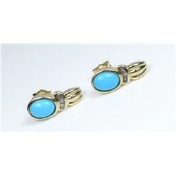 Gorgeous Turquoise and Diamond Earrings featuring 2 oval shaped cabochon Turquoise accented with 6
