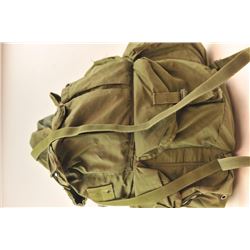Lot of 10 canvas O.D. green and digital camouflage rucksacks, back packs and gear hauling bags. P