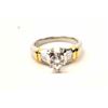 Image 1 : One platinum ring with 18k yellow gold accent  set with a 0.60ct  center and 8 baguettes  approx 0.5