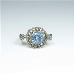 Stylish Aquamarine and Diamond Ring featuring a round Aquamarine weighing approx. 4.00 carats enci