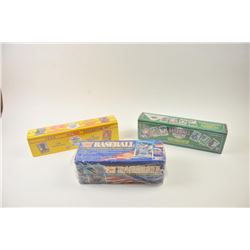 Lot of three unopened MLB collector card sets. The lot includes an unopened 1987 Fleer set in the