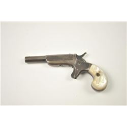 Early Allen Single Shot Derringer with iron frame, 1865 patent date, and pearl grips. Dark gray/br