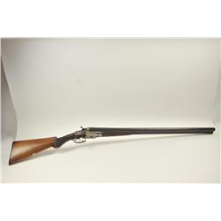 Double barrel Exposed Hammer Shotgun in 10 GA with locks marked “John Buckingham B.P. Birmingham”