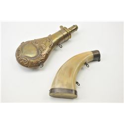 Lot of two mid-19th century flasks. One is embossed brass marked, A.M. Flask Co. with graduated 4