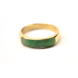 One elegant mans  ring inset with a custom  cut jade in 14k yellow gold  Est:$500-1000