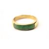 Image 1 : One elegant mans  ring inset with a custom  cut jade in 14k yellow gold  Est:$500-1000