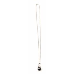 One beautiful Tahitian black pearl pendant made in 18k white gold set with diamonds., on a 20” w