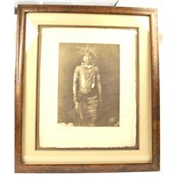 Sepia tone print entitled, “Snake Dancer in Costume”. The print is taken from a copy written phot