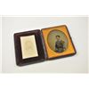 Image 1 : Photographic image lot consisting of an  ambrotype depicting a young squire, cased in  Moroccan leat