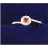 Image 1 : One petite ruby diamond halo ring made in 18  k white gold Est:$150-300