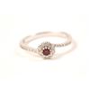 Image 2 : One petite ruby diamond halo ring made in 18  k white gold Est:$150-300
