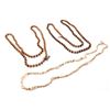 Image 1 : A collection of 2 genuine Lucite bead and a  miniature conch shell necklace longer than 30  inches  