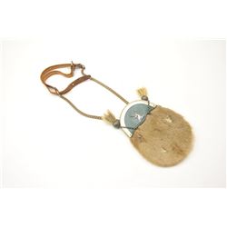 A small Scottish sporran of leather and deer fur. Silver stag on green Morocco. Silver tassels. La