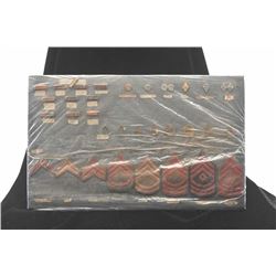 Lot of two displays of U.S. military uniform patches, medals and uniform cords; many of the items