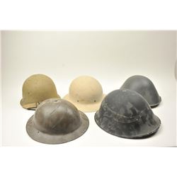Lot of 7 helmets as described: 1. U.S. Civil Defense helmet. Good with liner and straps. Marked “L.