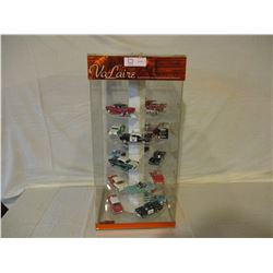 Rotating Shelf Display Case 12" W by 12" D by 24.5" T with 23 Assorted 1950s Chevrolet Cars